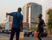 PHOTOS: Black marketeers loiter around NNPC Towers in Abuja, sell petrol in jerrycans