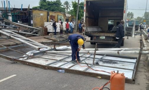 PHOTOS: Vehicles damaged as billboard falls in Lagos community