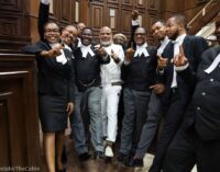 PHOTOS: Despite bail denial, Nnamdi Kanu strikes friendly pose with lawyers in court