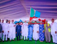 PHOTOS: Buhari presents APC flag to Tinubu