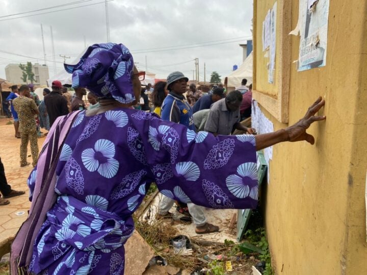 Eligible voters checking for their names on the wall before an election in Nigeria | File photo