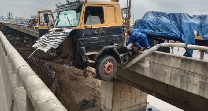 Panic as truck dangles from bridge along Lagos-Ibadan expressway