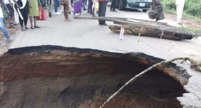 Commuters stranded as portion of major access road in Ekiti caves in