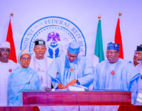 PHOTOS: The moment Buhari signed 2023 budget into law