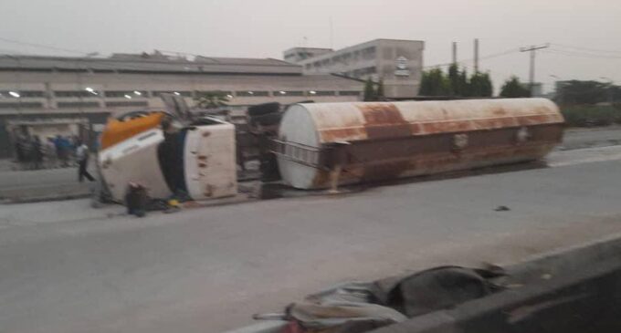 PHOTOS: Motorcyclist trapped as petrol tanker falls in Lagos