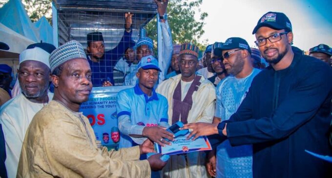 PHOTOS: Amid cash scarcity, Ganduje’s son vying for house of reps empowers youths with POS machines