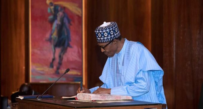 President now mandated to name cabinet within 60 days as Buhari signs amended bills into law