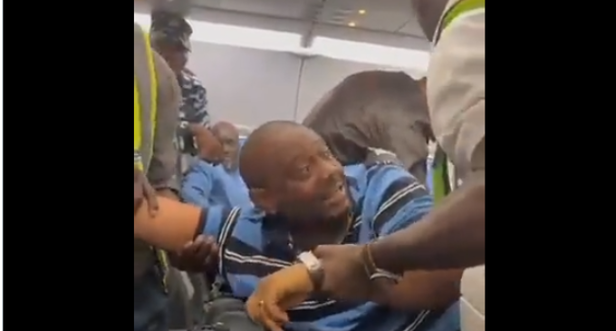 TRENDING VIDEO: Man shouting ‘Tinubu can’t be sworn in’ disrupts flight in Abuja