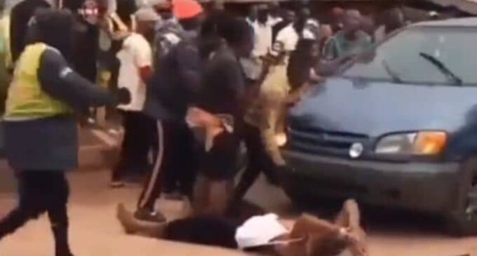 Outrage as video shows police officers running over handcuffed man in Edo