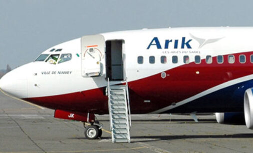Arik Air blames ‘bad weather’ as passengers protest being stranded at PH airport