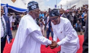President Bola Tinubu dhaking hands with Nyesom Wike