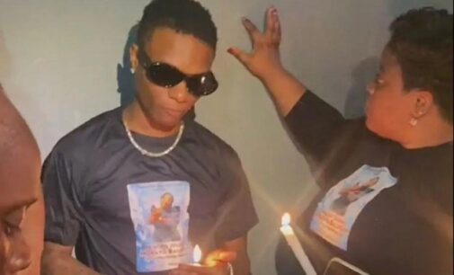 VIDEO: Grief-stricken Wizkid joins siblings at candlelight vigil for mum