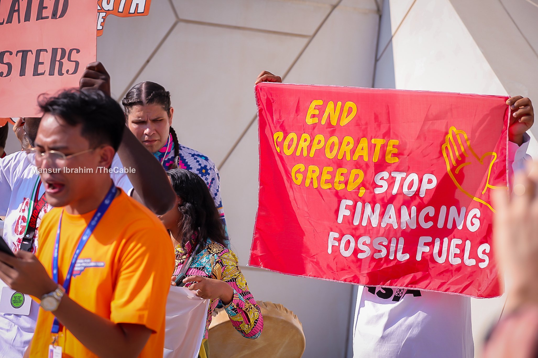 ‘Stop financing fossil fuels’ — activists carry placards at COP28