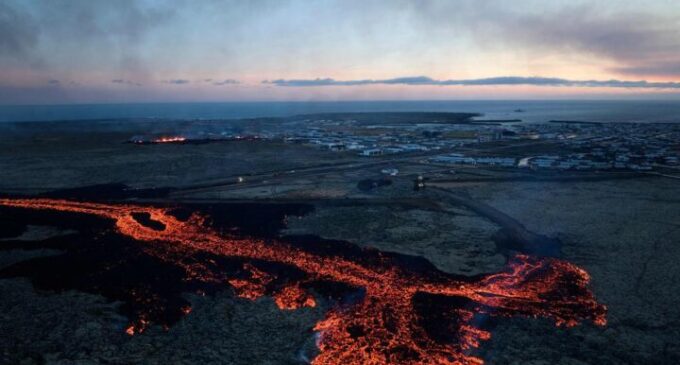 Lava spills from volcano into Iceland town, razes homes