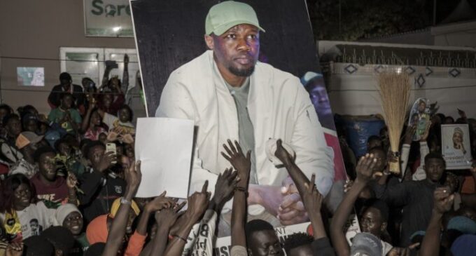 Celebrations in Senegal as opposition candidate secures early lead in presidential poll