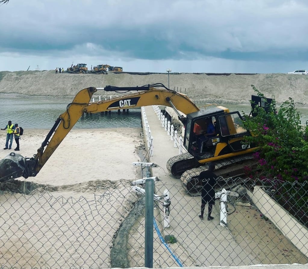 Bulldozer demolishing structures at Landmark