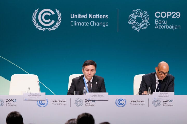Yalchin Rafiyev (L), COP29 lead negotiator, speaking during the opening ceremony | (Photo: UN Climate Change - Kamran Guliyev)