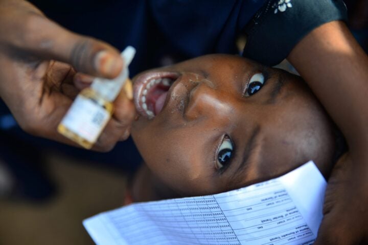 Aisha, 3, receives the polio vaccine in Sokoto... Photo by Patrick Egwu