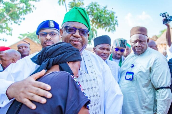 Caleb Mutfwang, Plateau governor, consoles woman after an attack on Bokkos LGA on April 2