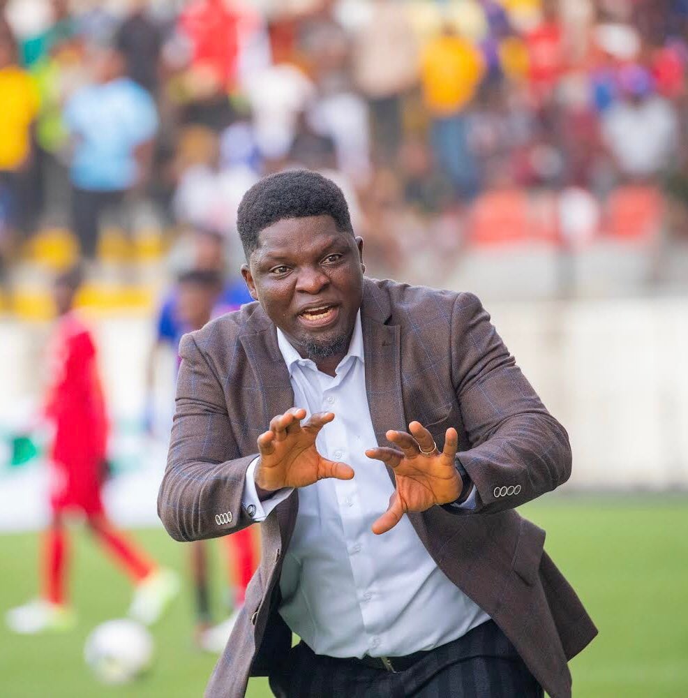 Ogunmodede on the touchline giving instructions to his players