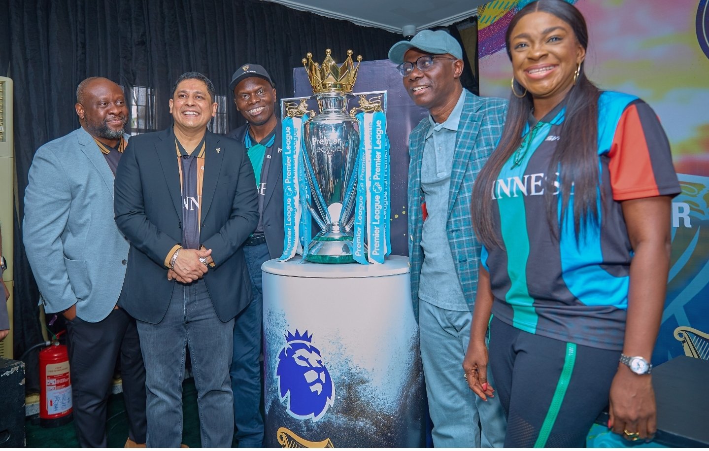 Governor Sanwo Olu and the Guinness Management team with the PL trophy