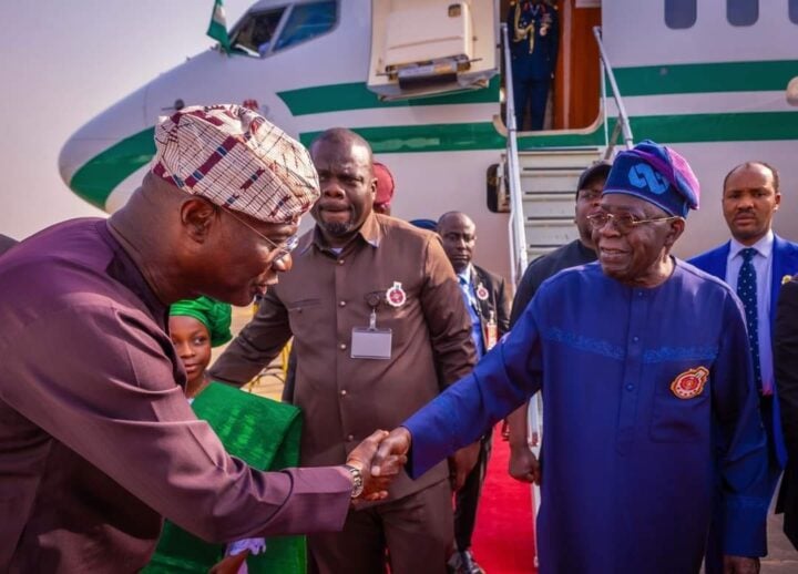 File photo of Tinubu being welcomed to Lagos by Sanwo-Olu in 2024