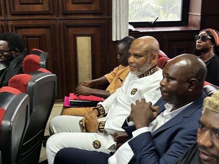 Nnamdi Kanu (middle, dressed in white Fendi) in court