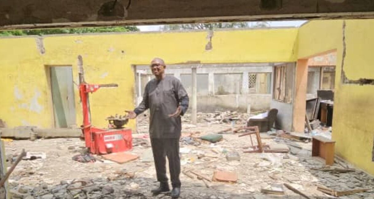 Peter Obi in the ruins of the demolished property