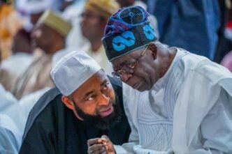 Umar Bago (left) with President Bola Tinubu