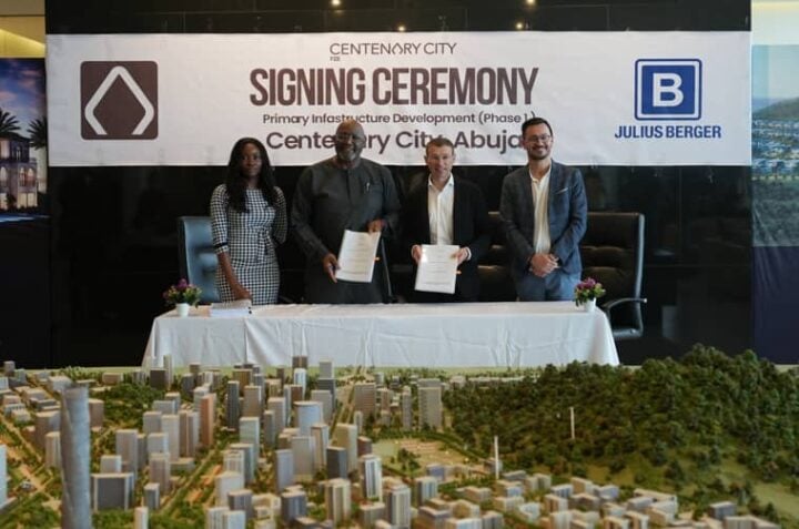 Second right is the Managing Director, Julius Berger Nigeria PLC, Engr. Dr. Peer Lubasch; standing next to him is the Managing Director, Abuja Centenary City, Dr. Odenigwe Ike Michaels Jr., after the signing of the contract for the construction of roads and related infrastructure in the city, last Friday. The Regional Manager, Julius Berger's Region Central and North, Engr. Oliver Berger, first right looks on