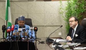Richard Mills, US ambassador to Nigeria (R) and Mohammed Idris, the minister of information