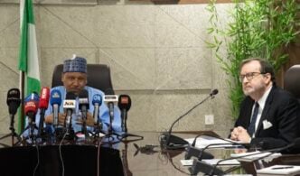 Richard Mills, US ambassador to Nigeria (R) and Mohammed Idris, the minister of information