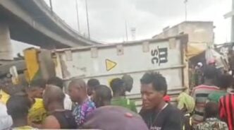 container-laden truck crushes tricycle in ijora, Lagos