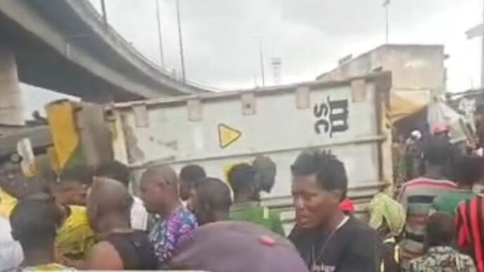 container-laden truck crushes tricycle in ijora, Lagos