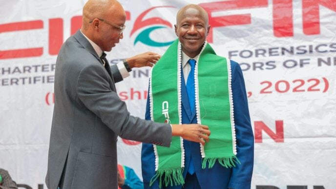 L-R: Iliyasu Gashinbaki, pioneer president and chairman, governing council of Chartered Institute of Forensics and Certified Fraud Investigators of Nigeria; and Ibrahim Magu, a former acting chairman of the Economic and Financial Crimes Commission (EFCC), during Magu's induction as fellow of the institute in Abuja