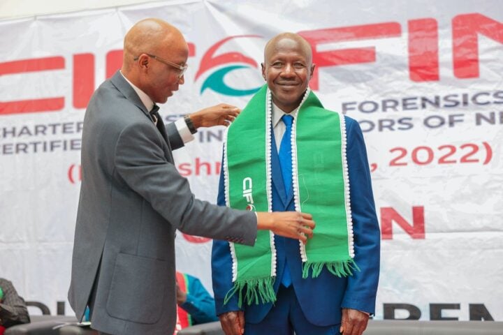 L-R: Iliyasu Gashinbaki, pioneer president and chairman, governing council of Chartered Institute of Forensics and Certified Fraud Investigators of Nigeria; and Ibrahim Magu, a former acting chairman of the Economic and Financial Crimes Commission (EFCC), during Magu's induction as fellow of the institute in Abuja