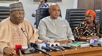 Mahmood Yakubu, the INEC chairman (left)