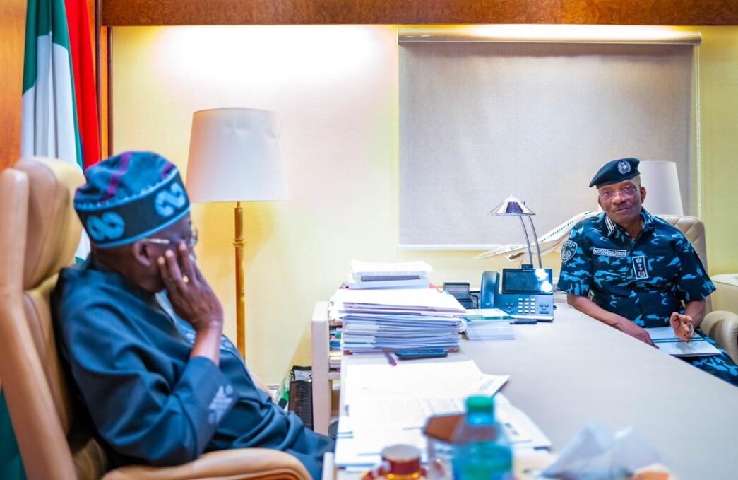 President Bola Tinubu and Kayode Egbetokun, the inspector-general of police