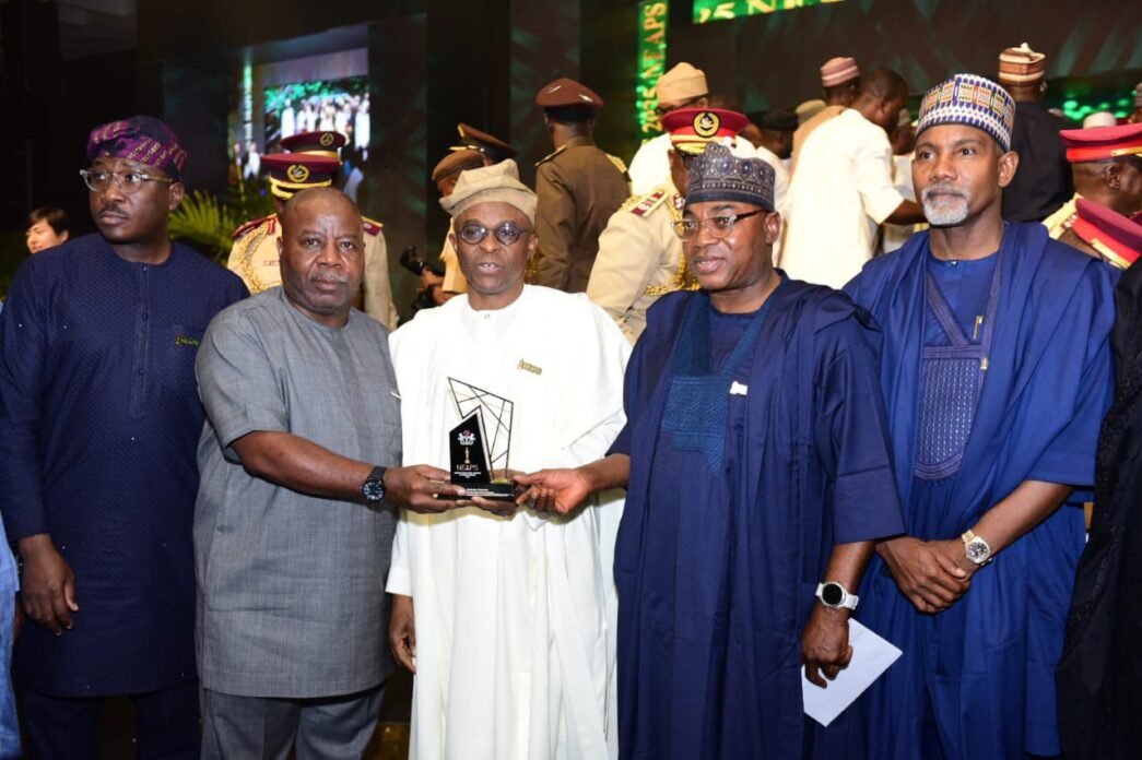 Abubakar Dantsoho (3rd from left in white) receiving his statuette at the awards