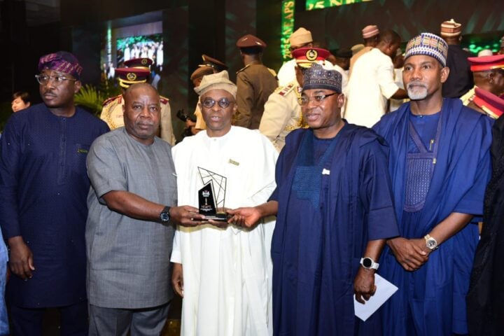 Abubakar Dantsoho (3rd from left in white) receiving his statuette at the awards